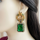 Raneem Emerald Green earrings close-up on a mannequin