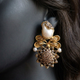 Gulpari Onyx earrings close-up on a mannequin