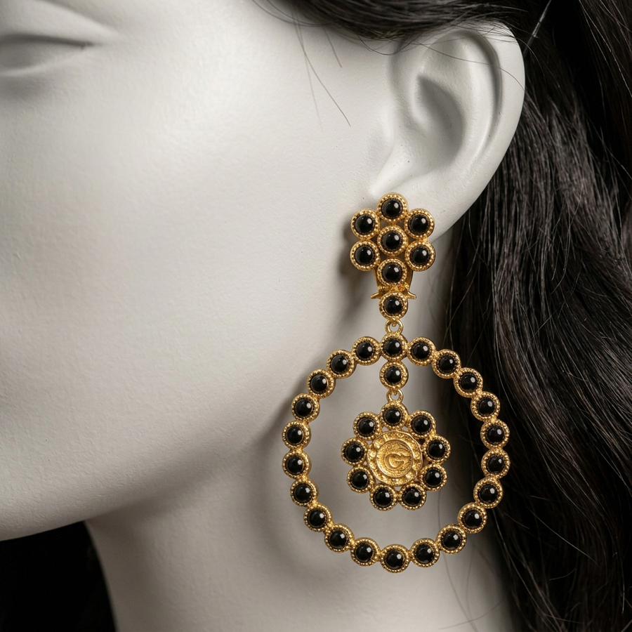 Naqsh-e-Qamar Onyx earrings close-up on a mannequin