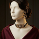 Rangreza Onyx choker and matching earring styled on an ivory mannequin with dark hair and burgundy silk