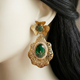 Zarqash Emerald Green earrings close-up on a mannequin