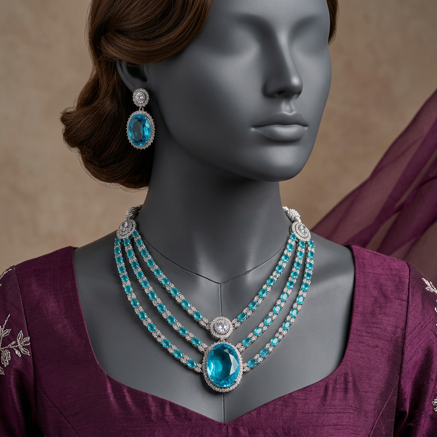 Aabgina Aqua Frost necklace set on a charcoal mannequin in plum silk formalwear