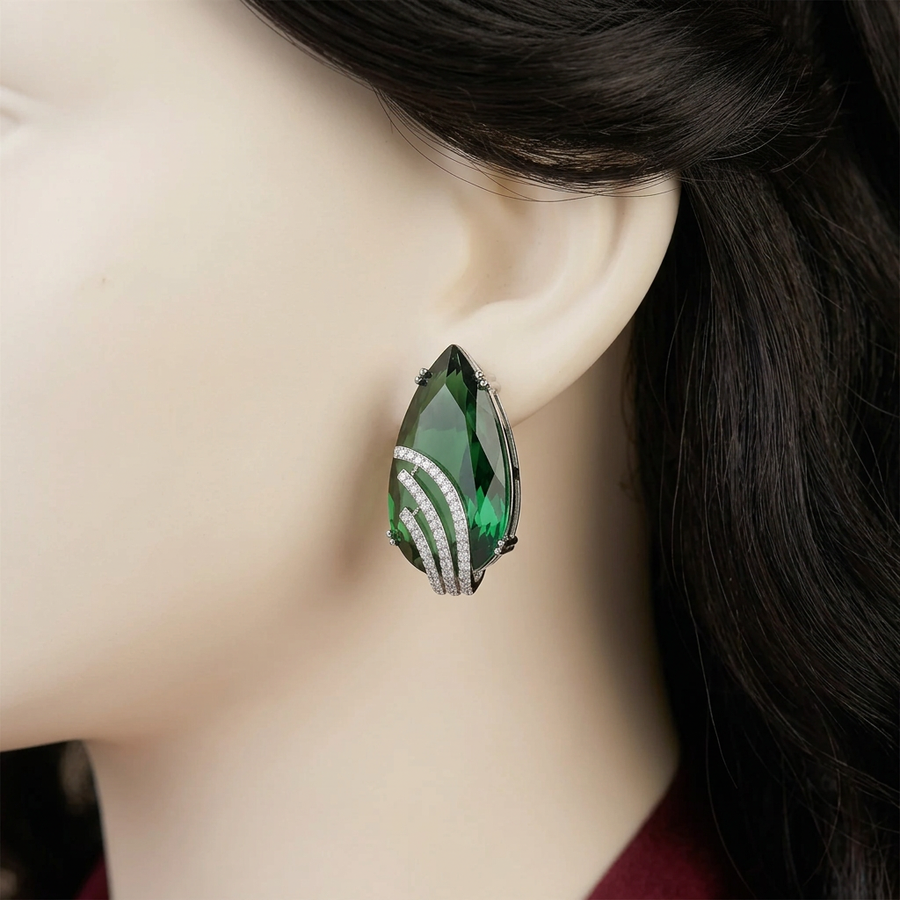 Aaina Emerald Green earrings close-up on a mannequin