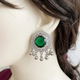 Raqs Emerald Green earrings close-up on a mannequin