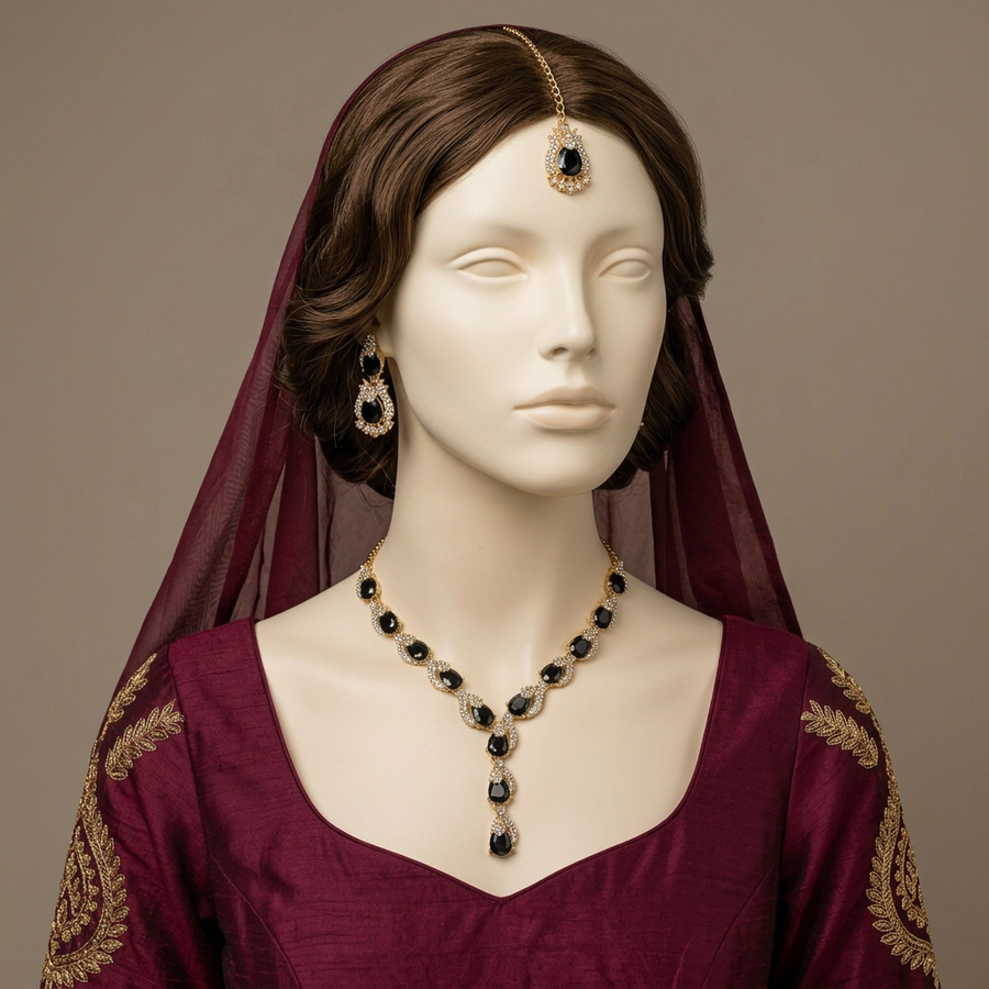 Aabshaar Onyx necklace and earrings with matching tikka worn as a centred bindiya on an ivory mannequin