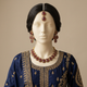 Shabnam S-70 Ruby necklace, earrings and tikka on an ivory mannequin in embroidered wedding attire