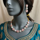 Gohar-e-Aab Rose necklace set on a mannequin