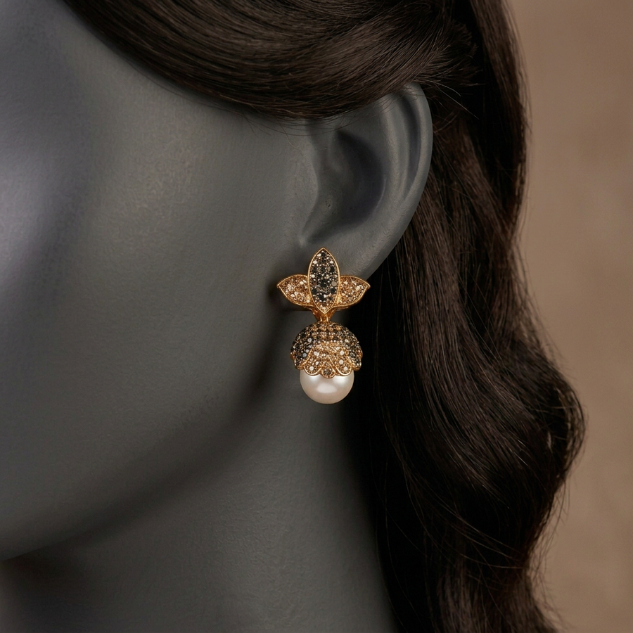 Tight detail close-up of Pankhuri ER-181 Champagne earring on a charcoal mannequin showing the leaf stud, floral dome and pearl drop